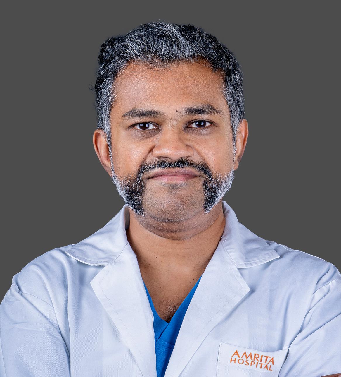 Dr. Mathew George